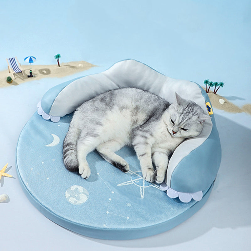 Grey tabby cat resting on a light blue soft cooling pet bed with an ice silk cushion, enjoying a cozy nap.