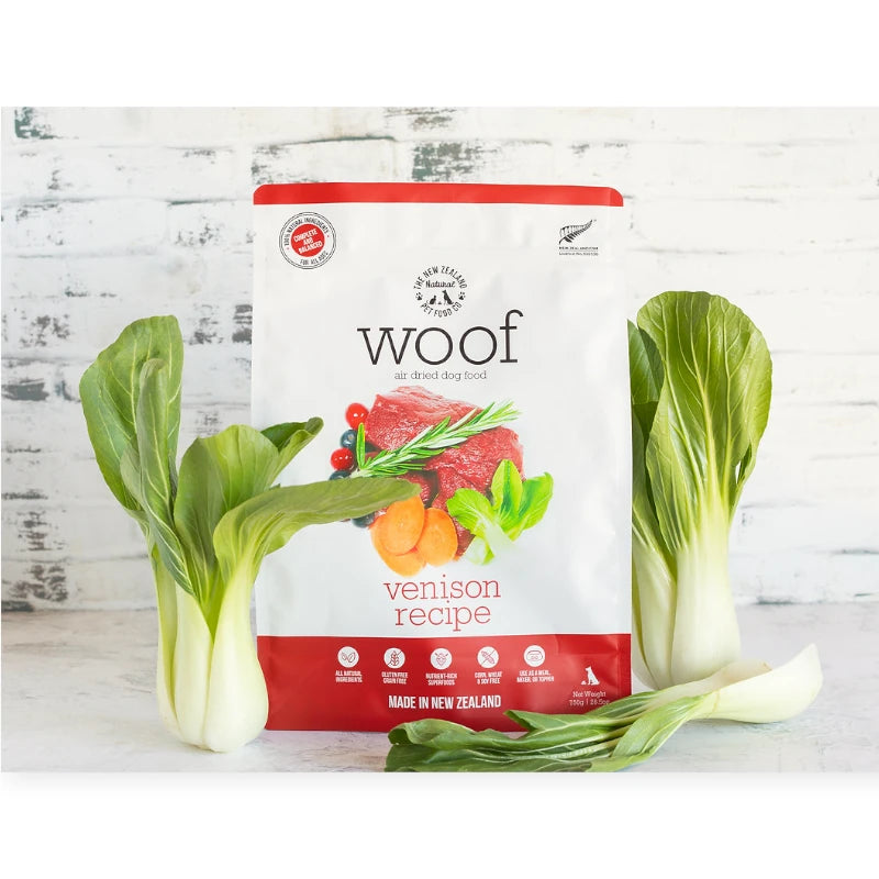 "Front view of Woof Venison Air-Dried Dog Food packaging with fresh venison, bok choy, and cranberries."
