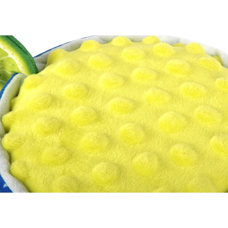 Close-up of textured yellow top of P.L.A.Y. Pup-arita Margarita Dog Toy.